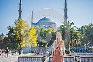 Woman tourist enjoying the view Blue Mosque, Sultanahmet Camii, Istanbul, Turkey