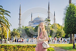 Woman tourist enjoying the view Blue Mosque, Sultanahmet Camii, Istanbul, Turkey