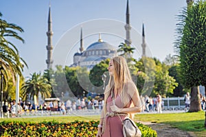 Woman tourist enjoying the view Blue Mosque, Sultanahmet Camii, Istanbul, Turkey