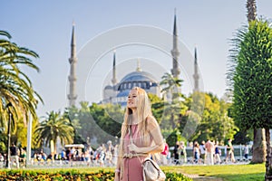 Woman tourist enjoying the view Blue Mosque, Sultanahmet Camii, Istanbul, Turkey