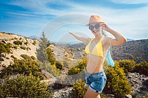 Woman tourist in front of southern European landscape