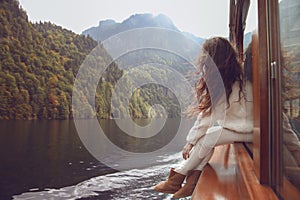 Woman tourist going on boat in Konigssee lake, Berchtesgaden, Ge photo