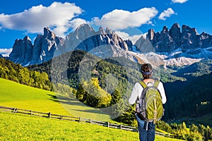 Woman-tourist in green Alpine meadows