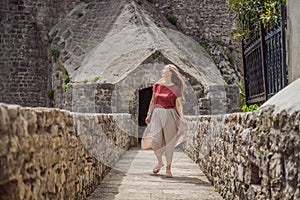 Woman tourist in Herceg Novi old town. Historical and touristic center of Herceg Novi. Montenegro