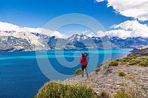 Woman tourist hiking, Chile travel, Bertran lake and mountains beautiful landscape, Chile, Patagonia, South America