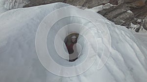 Woman is a tourist in the ice of Lake Baikal.