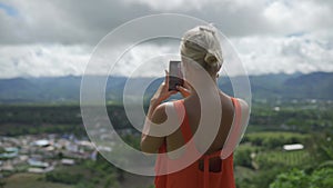 Woman tourist making photo at Yun Lai Viewpoint.