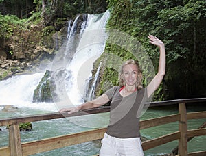 The woman tourist near Dunn's River Jamaica falls