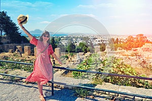 Woman tourist near the gulf and the ruins of Carthage from Byrsa Hill. Tourism in Tunisia, North Africa. Mandraki bay is