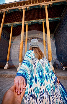 Woman tourist at old city Khiva in Uzbekistan