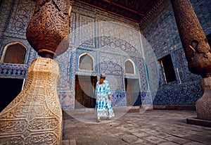 Woman tourist at old city Khiva in Uzbekistan