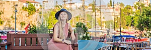 Woman tourist in Old town Kaleici in Antalya. Turkiye. Panoramic view of Antalya Old Town port, Taurus mountains and