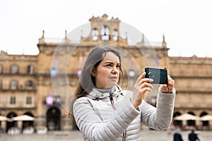 Woman tourist with phone, Salamanca, Spain