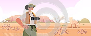 woman tourist or photographer making travel photo of wildlife on digital camera photo service concept wild landscape