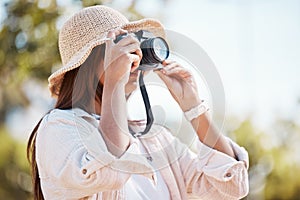 Woman, tourist and photography in nature with camera for travel, adventure or sightseeing scenery. Female photographer