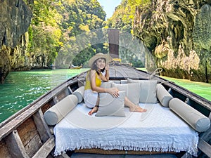 Woman tourist in private longtail boat trip to Lagoon koh hong near Hong island, Krabi, Thailand. landmark, destination, Asia