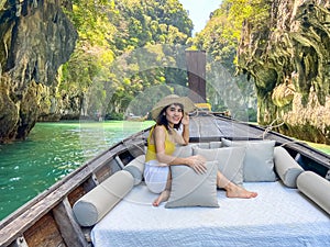 Woman tourist in private longtail boat trip to Lagoon koh hong near Hong island, Krabi, Thailand. landmark, destination, Asia