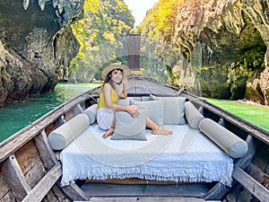 Woman tourist in private longtail boat trip to Lagoon koh hong near Hong island, Krabi, Thailand. landmark, destination, Asia