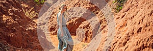 Woman tourist in red canyon, resumption of tourism concept BANNER, LONG FORMAT