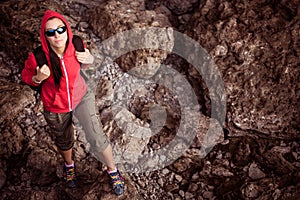 Woman tourist in the rocky grot photo