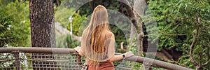 Woman tourist in Rope bridge in Yildiz Park. Besiktas, Istanbul, Turkey. Turkiye BANNER, LONG FORMAT