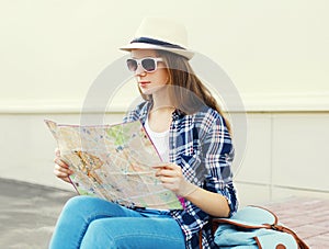 Woman tourist sightseeing city with paper map