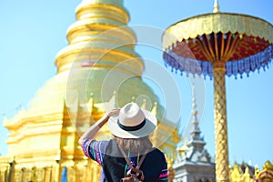 Woman tourist is sightseeing at Wat Phra That Hariphunchai in Lamphun