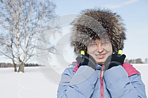 Woman tourist skier in snowy forest