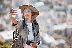 Woman, tourist and smile for travel selfie on hiking adventure, backpacking journey or profile picture in nature. Female