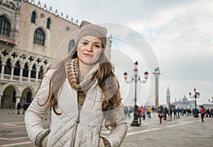 Woman tourist on St. Marks Square near Dogi Palace, Venice photo