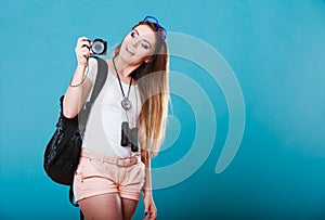 Woman tourist taking photo with camera