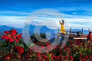 Woman tourist taking photo of Doi Luang Chiang Dao mountains, Chiang mai, Thailand