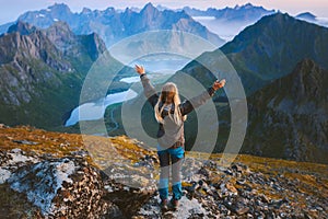 Woman tourist traveling in Norway alone enjoying aerial mountain view hiking in mountains outdoor