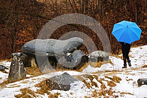 Woman tourist traveling through Romania. Trovanti, Costesti Valc