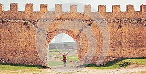 Woman tourist visiting Gormaz castle, Soria province