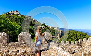 Woman tourist visiting Moorish castle