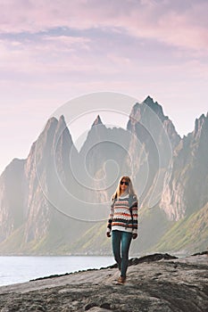 Woman tourist walking in Norway adventure travel healthy lifestyle outdoor