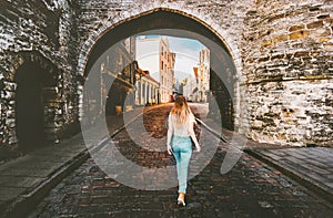 Woman tourist walking in Tallinn Old Town solo traveling vacations