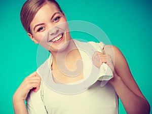 Woman with a towel around her shoulders smiling