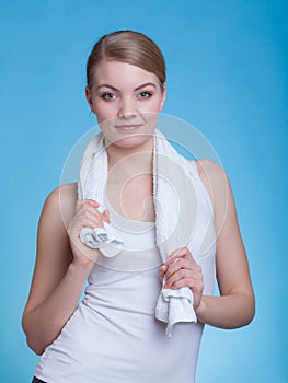 Woman with a towel around her shoulders smiling