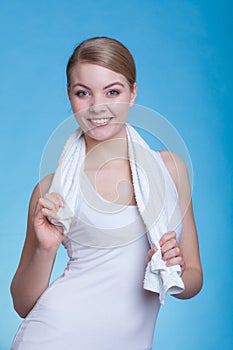 Woman with a towel around her shoulders smiling