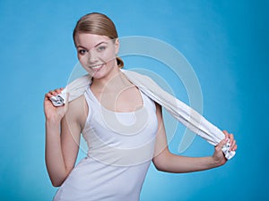 Woman with a towel around her shoulders smiling