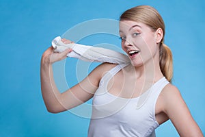 Woman with a towel around her shoulders smiling