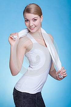 Woman with a towel around her shoulders smiling