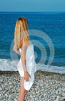 Woman in a towel on a beach