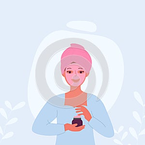 A woman with a towel on her head has a mask or cream on her face
