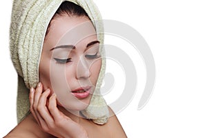 Woman in towel turban on white background. Skin care.