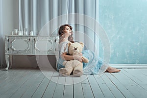 Woman with a toy bear.