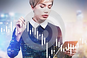 Woman trader using digital graph in night city