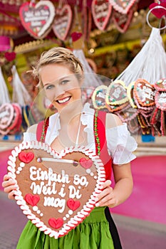 Woman in traditional Bavarian clothes or dirndl on festival